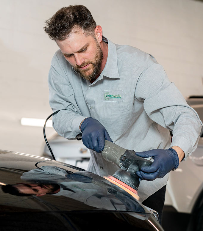 Colorworks technician performing paint correction on a vehicle.