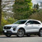 Cadillac with glossy ceramic coating finish parked outdoors.