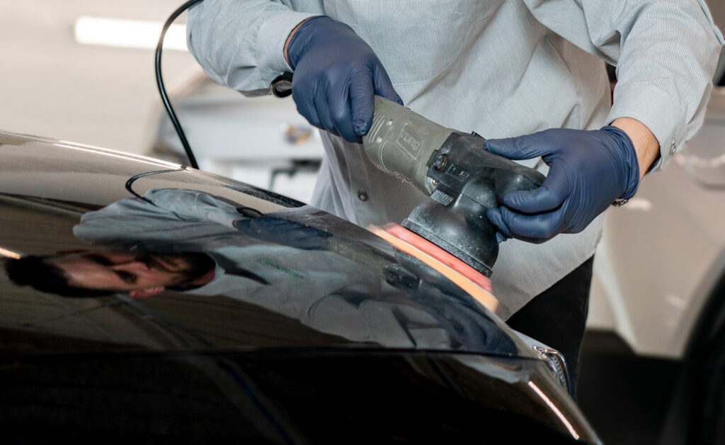 Colorworks technician performing paint correction on a vehicle.