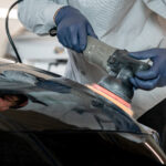 Colorworks technician performing paint correction on a vehicle.